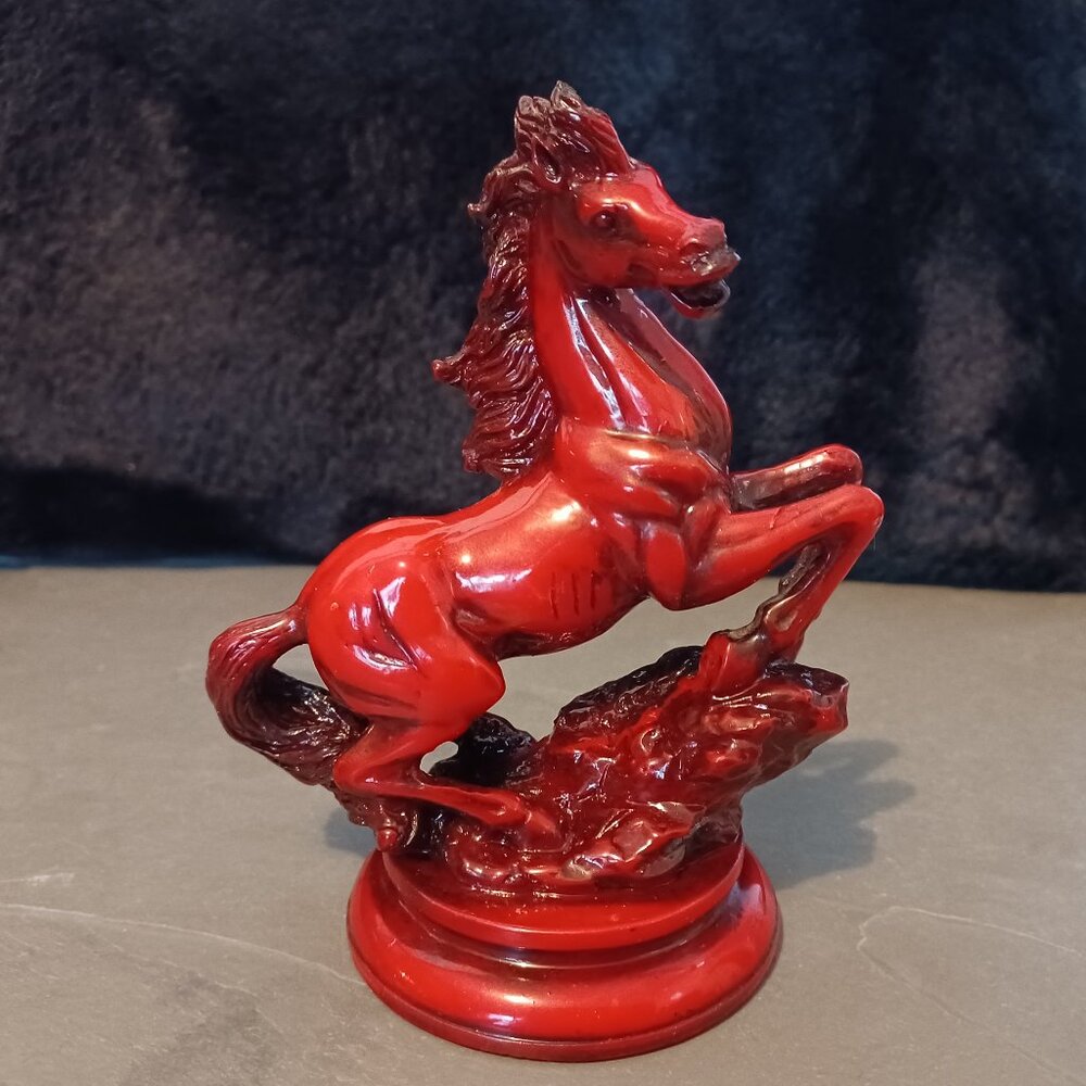 Blood red hand-carved horse figurine